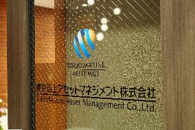 Tokyo Marine Asset Management signboard and logo